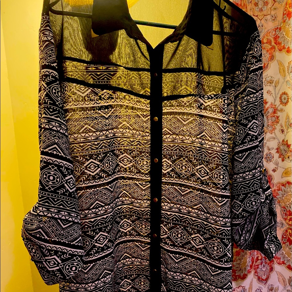 Sheer black and white blouse.